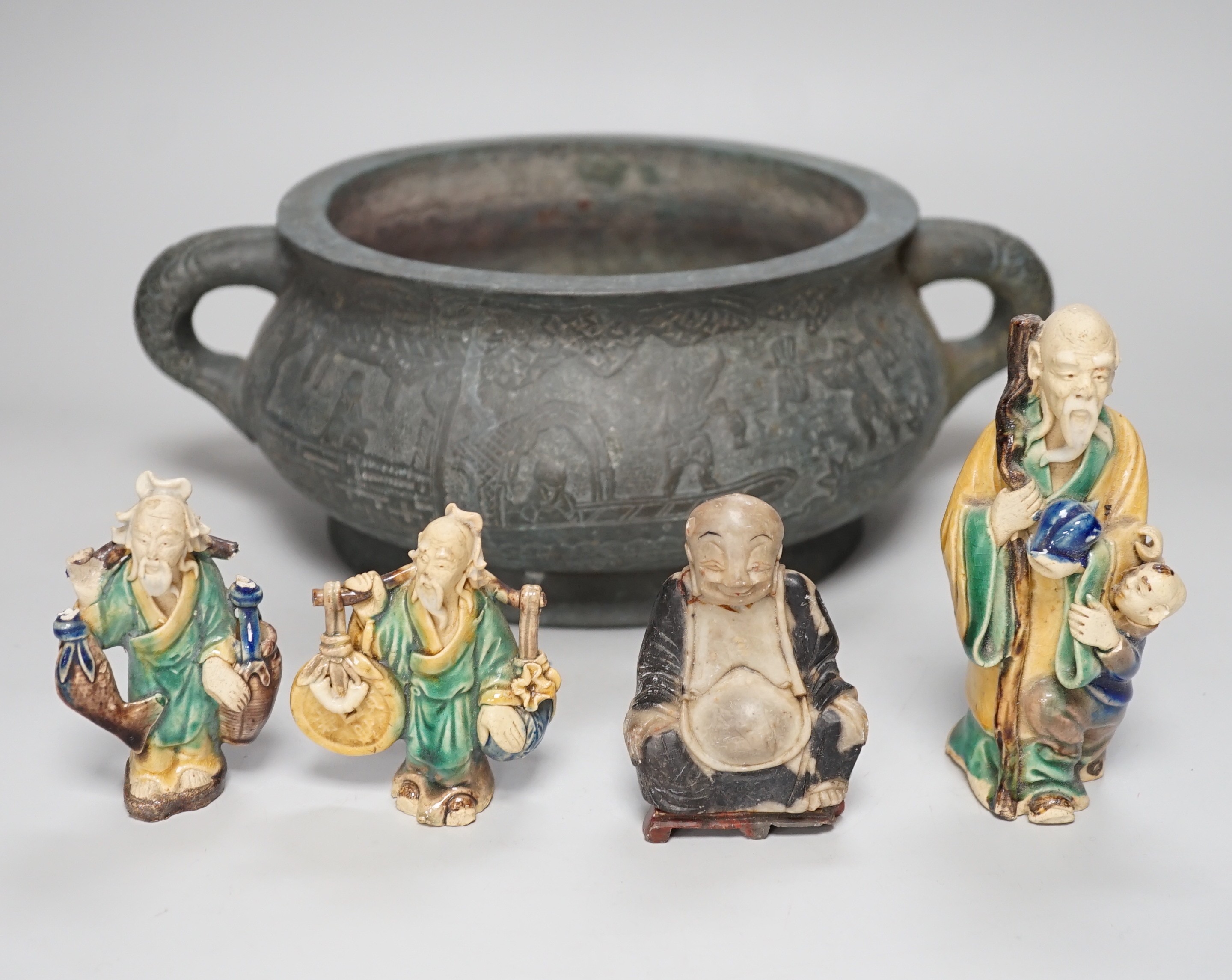 A large late 19th/early 20th century Chinese bronze censer, gui, Xuande mark, together with four Chinese figures. Tallest 12cm